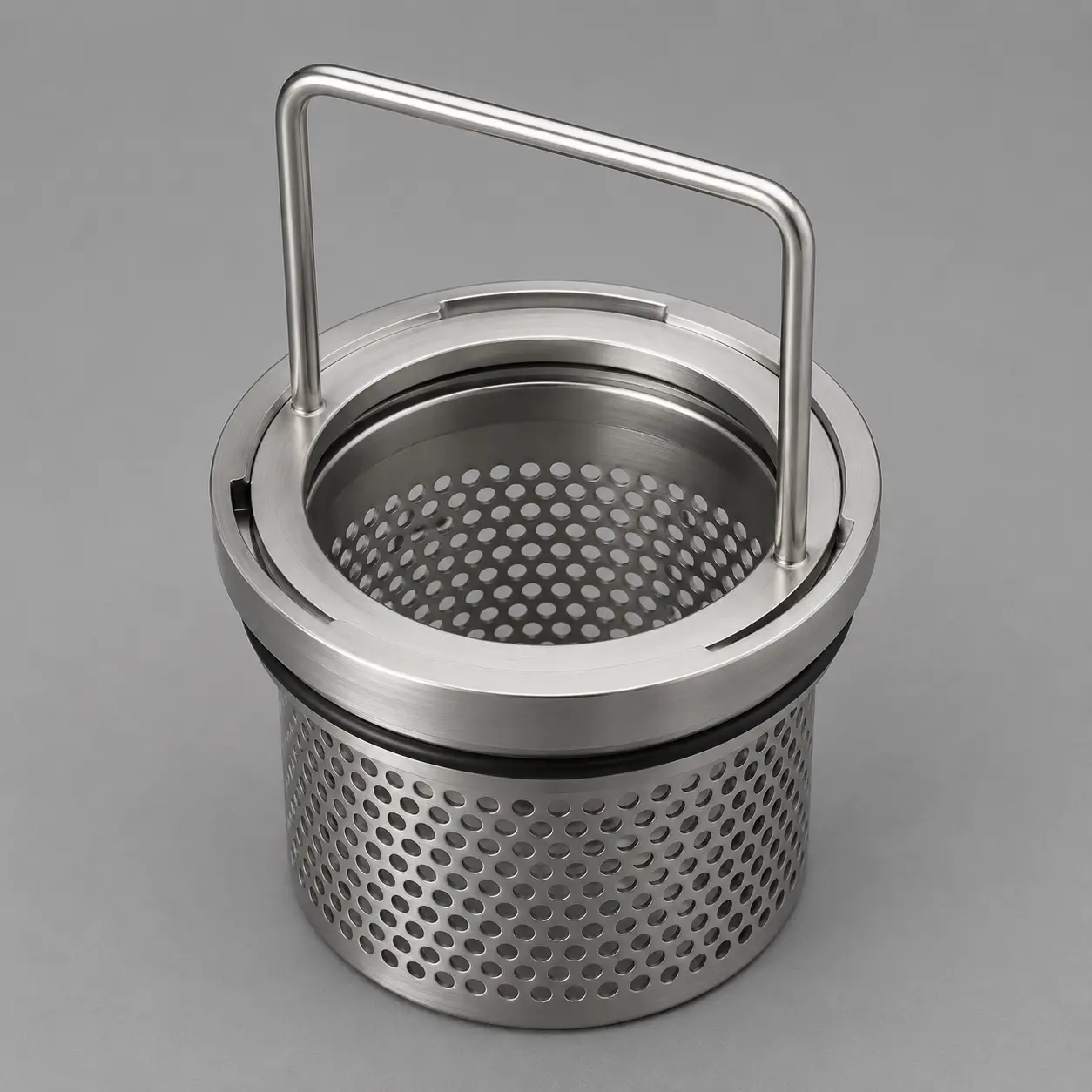 Quick release handle connected to machined flange on perforated basket