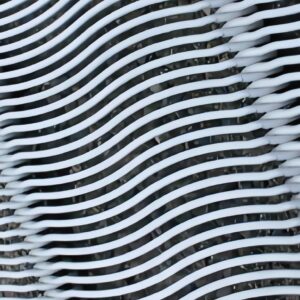 Close-up of stainless steel wedge wire screen showing continuous slot openings between profile wires
